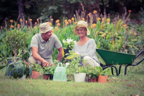 Professional lawn mower servicing a garden in Palmers Green